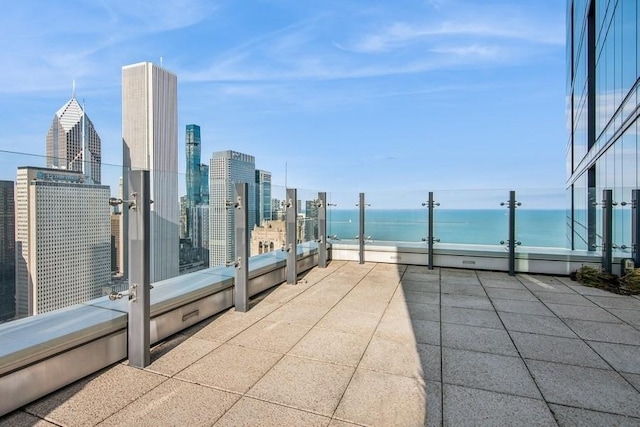 view of patio featuring a water view