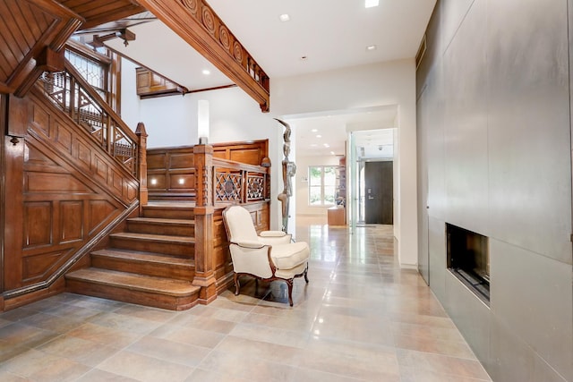 stairway featuring a fireplace