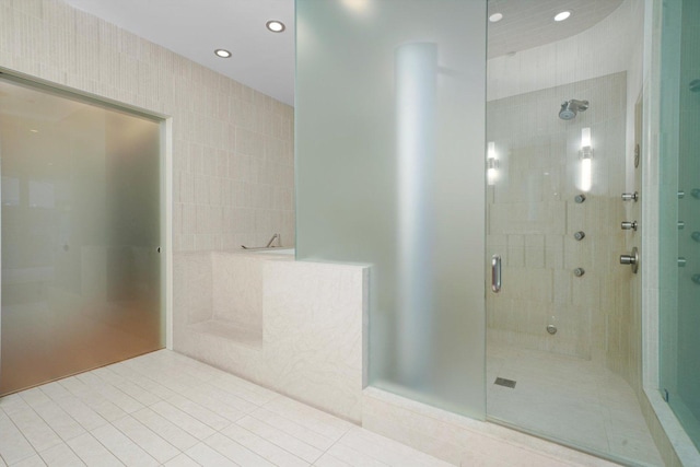 bathroom featuring tile patterned flooring, a stall shower, and recessed lighting
