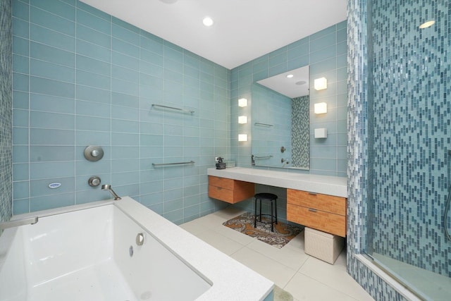 bathroom featuring tile walls, tiled shower, tile patterned floors, and a whirlpool tub