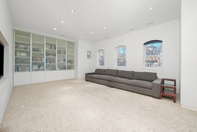 carpeted living area with recessed lighting