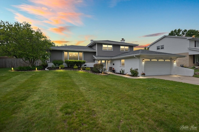 8S100 Washington St, Darien, IL 60561 - tri-level home with an attached garage, concrete driveway, and a chimney