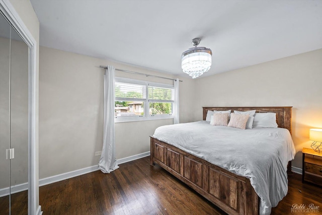8S100 Washington St, Darien, IL 60561 - bedroom featuring dark wood-type flooring, a chandelier, and baseboards