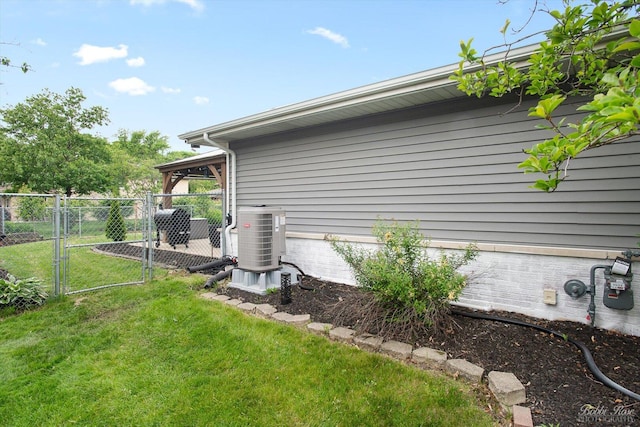 8S100 Washington St, Darien, IL 60561 - view of side of home featuring a gate and central air condition unit