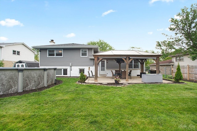 8S100 Washington St, Darien, IL 60561 - rear view of house with a gazebo, a patio area, and a chimney