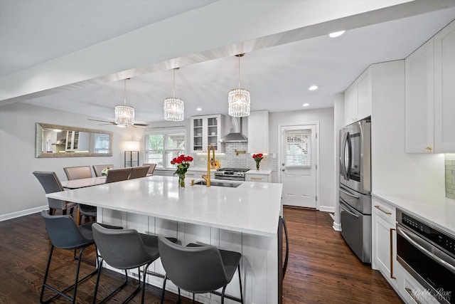 8S100 Washington St, Darien, IL 60561 - kitchen featuring stainless steel appliances, baseboards, backsplash, a breakfast bar area, and recessed lighting