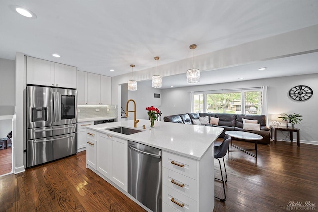 8S100 Washington St, Darien, IL 60561 - kitchen with appliances with stainless steel finishes, a sink, dark wood-style flooring, open floor plan, and recessed lighting
