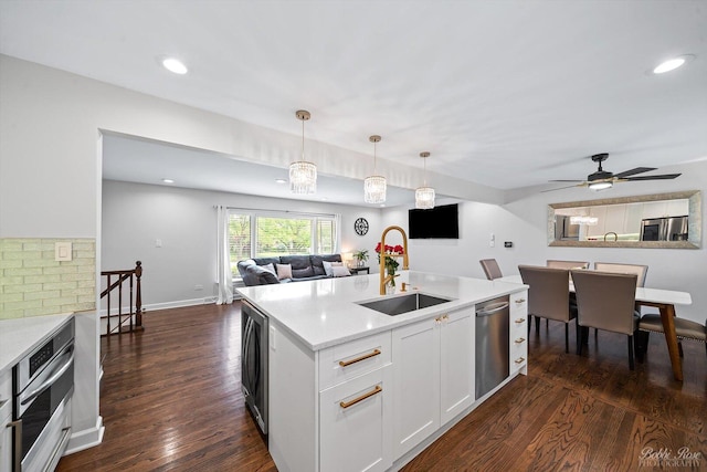 8S100 Washington St, Darien, IL 60561 - kitchen featuring a sink, appliances with stainless steel finishes, open floor plan, dark wood-style flooring, and recessed lighting