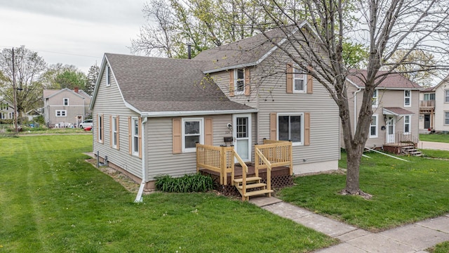 view of front of property featuring a front yard, a residential view, and a shingled roof
