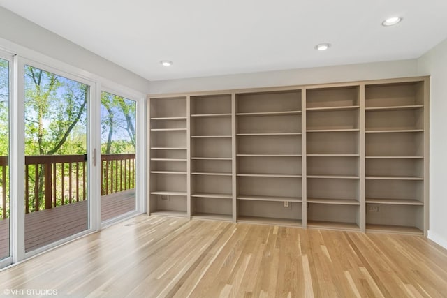 spare room with wood finished floors and recessed lighting