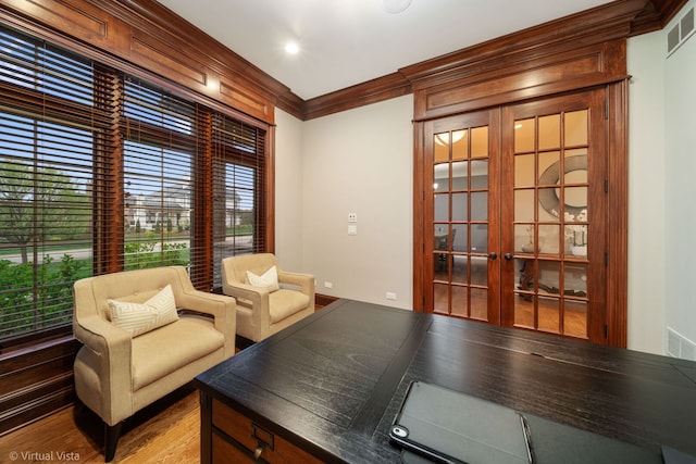 sitting room featuring ornamental molding, french doors, and visible vents