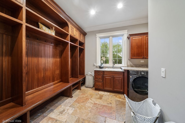 mudroom with recessed lighting, stone tile flooring, ornamental molding, a sink, and washer / dryer
