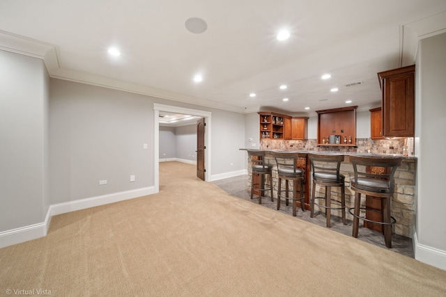 bar with recessed lighting, baseboards, ornamental molding, backsplash, and light carpet
