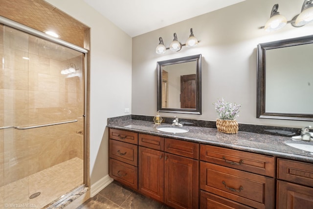 full bathroom with double vanity, a stall shower, and a sink