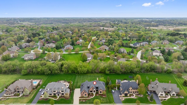 birds eye view of property with a residential view