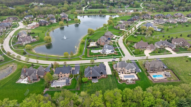 aerial view with a water view and a residential view