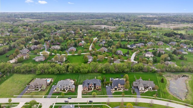 birds eye view of property with a residential view