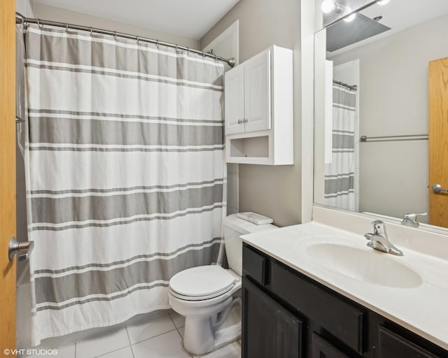full bathroom with curtained shower, tile patterned flooring, toilet, and vanity
