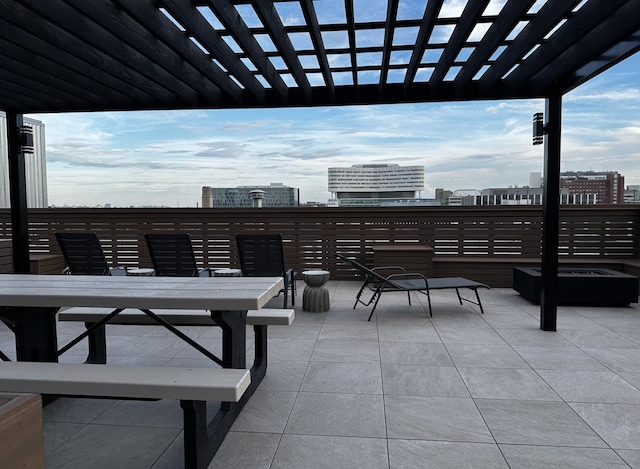 1645 W Ogden Ave Unit 341, Chicago, IL 60612 - view of patio featuring a pergola and a city view