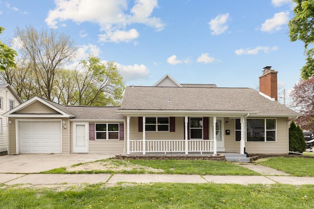 205 S 10th Ave, Saint Charles, IL 60174 - view of front of home with covered porch, an attached garage, roof with shingles, a front yard, and driveway