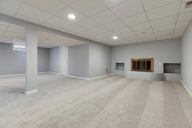 205 S 10th Ave, Saint Charles, IL 60174 - finished below grade area with carpet flooring, a fireplace, a paneled ceiling, baseboards, and recessed lighting