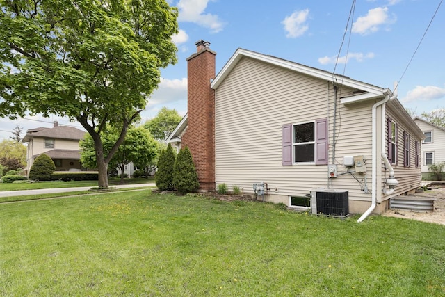 205 S 10th Ave, Saint Charles, IL 60174 - view of home's exterior with a chimney and a yard