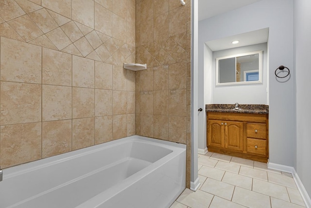 205 S 10th Ave, Saint Charles, IL 60174 - full bath with baseboards, a bath, vanity, and tile patterned floors