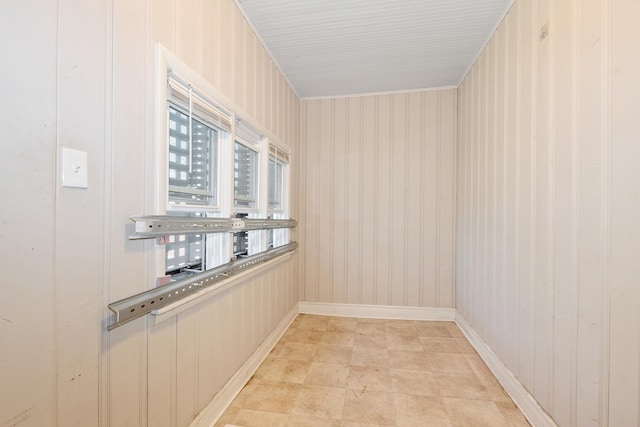spare room with baseboards