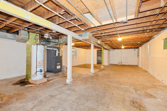 unfinished basement with water heater and heating unit