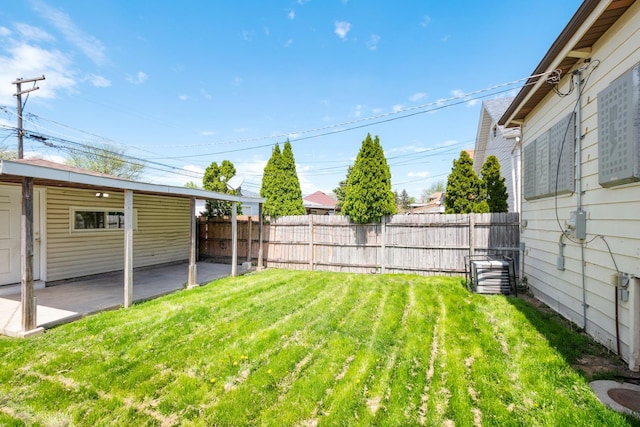 view of yard featuring cooling unit and a patio area