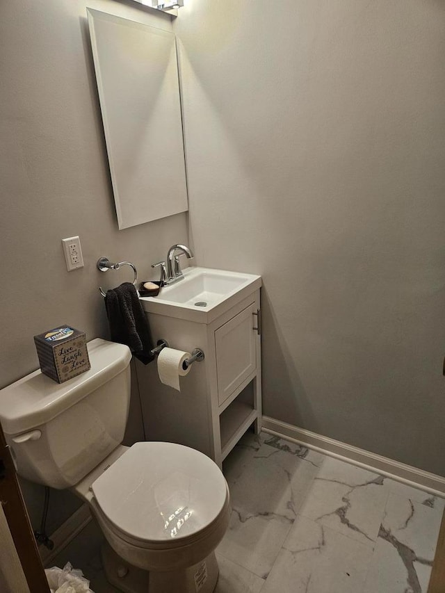 7202 W Crain St, Niles, IL 60714 - bathroom with vanity, toilet, marble finish floor, and baseboards
