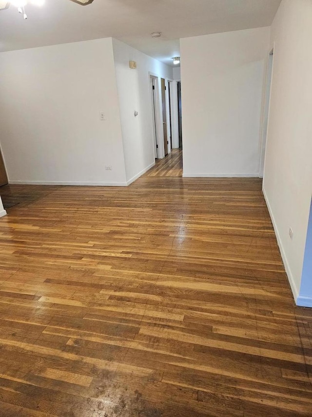 7202 W Crain St, Niles, IL 60714 - unfurnished room with wood finished floors and baseboards