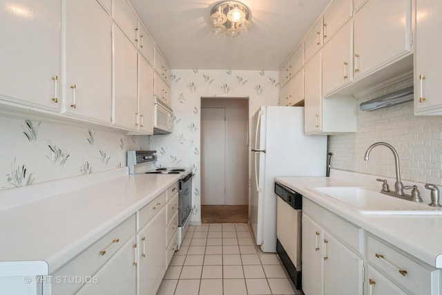 7061 N Kedzie Ave Unit 1504, Chicago, IL 60645 - kitchen featuring white appliances, a sink, light tile patterned flooring, light countertops, and tasteful backsplash