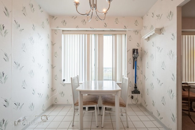 7061 N Kedzie Ave Unit 1504, Chicago, IL 60645 - dining space featuring a chandelier, light tile patterned flooring, and wallpapered walls
