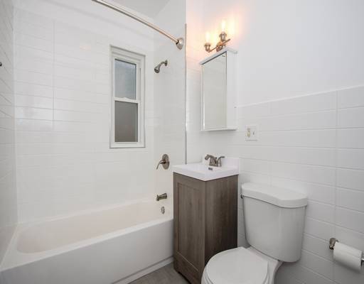 full bath featuring vanity, toilet, and tub / shower combination