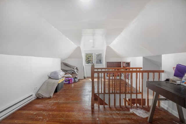 bonus room with vaulted ceiling, a baseboard radiator, and hardwood / wood-style flooring