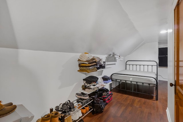 bedroom featuring vaulted ceiling and wood finished floors