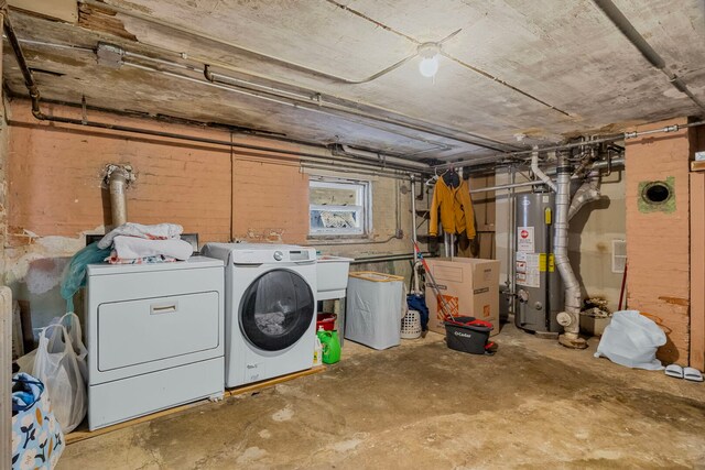 below grade area with water heater and washing machine and dryer