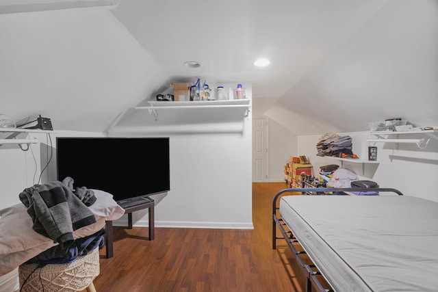 bedroom with vaulted ceiling, wood finished floors, and recessed lighting