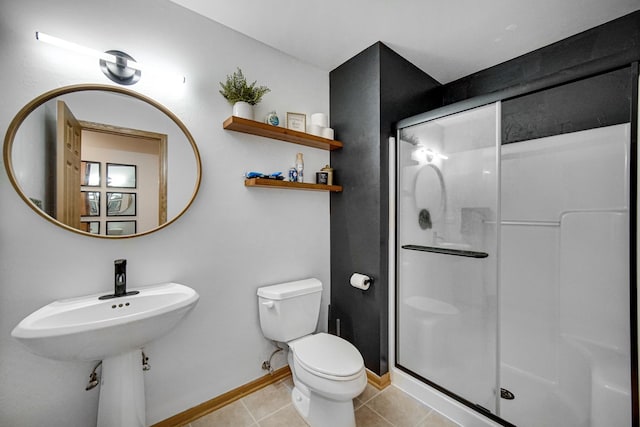 100 N Bokelman St Unit 430, Roselle, IL 60172 - bathroom featuring toilet, a shower stall, baseboards, and tile patterned floors