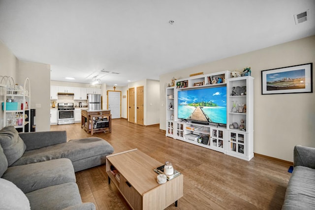 100 N Bokelman St Unit 430, Roselle, IL 60172 - living room featuring baseboards, light wood finished floors, and recessed lighting