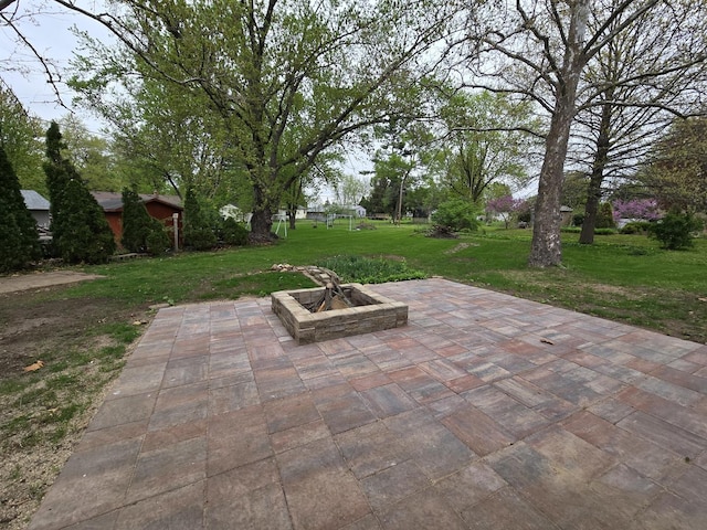 view of patio / terrace with an outdoor fire pit