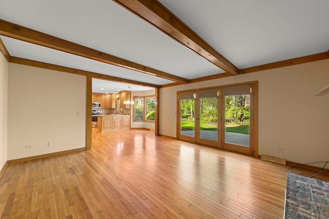 1624 Mirror Lake Dr, Naperville, IL 60563 - unfurnished living room featuring beamed ceiling, light wood finished floors, and baseboards