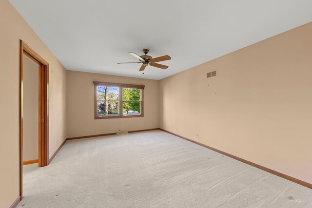 1624 Mirror Lake Dr, Naperville, IL 60563 - spare room featuring a ceiling fan, light carpet, and baseboards