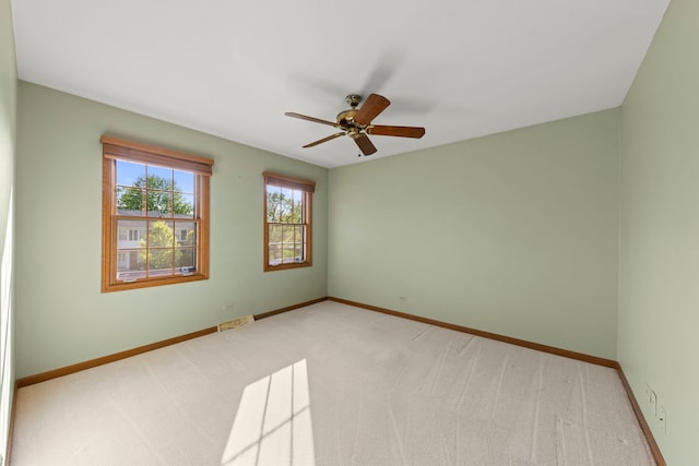 1624 Mirror Lake Dr, Naperville, IL 60563 - unfurnished room with baseboards, light colored carpet, and a ceiling fan