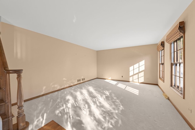 1624 Mirror Lake Dr, Naperville, IL 60563 - unfurnished living room featuring carpet, baseboards, and stairway