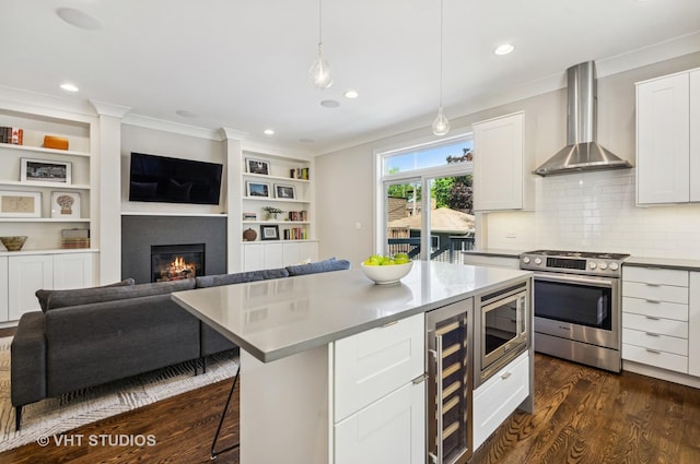 5263 N Laporte Ave, Chicago, IL 60630 - kitchen with appliances with stainless steel finishes, wall chimney range hood, beverage cooler, ornamental molding, and dark wood-style flooring