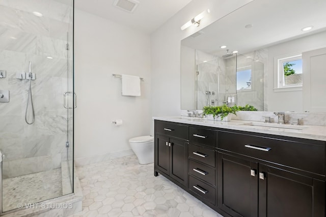 5263 N Laporte Ave, Chicago, IL 60630 - full bathroom with a marble finish shower, double vanity, toilet, baseboards, and tile patterned floors