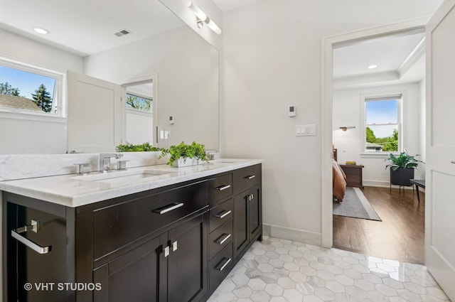 5263 N Laporte Ave, Chicago, IL 60630 - ensuite bathroom with double vanity, baseboards, recessed lighting, and tile patterned flooring