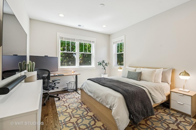 5263 N Laporte Ave, Chicago, IL 60630 - bedroom with an office area, recessed lighting, wood finished floors, and baseboards